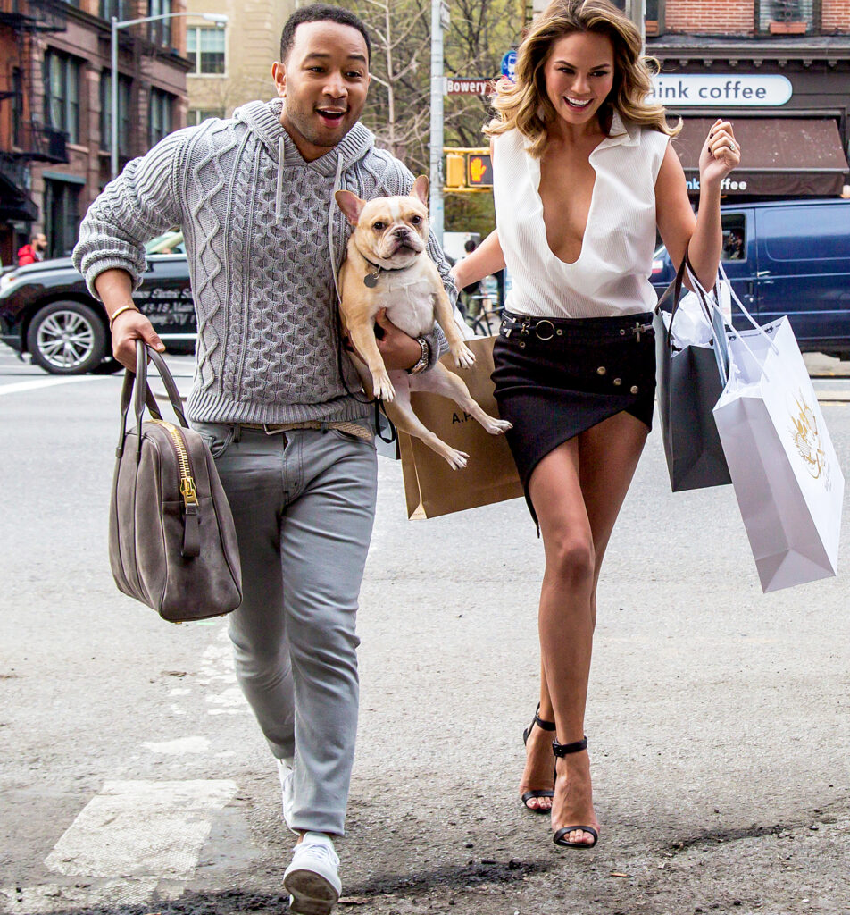 Chrissy Teigen and John Legend with their dog
